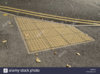 tactile-paving-at-the-crossing-point-of-a-road-to-help-visually-impaired-D0FEYW.jpg